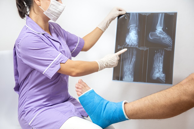 bone-fracture-foot-leg-male-patient-being-examined-by-woman-doctor-hospital-chrysa-vafeiadi-physio